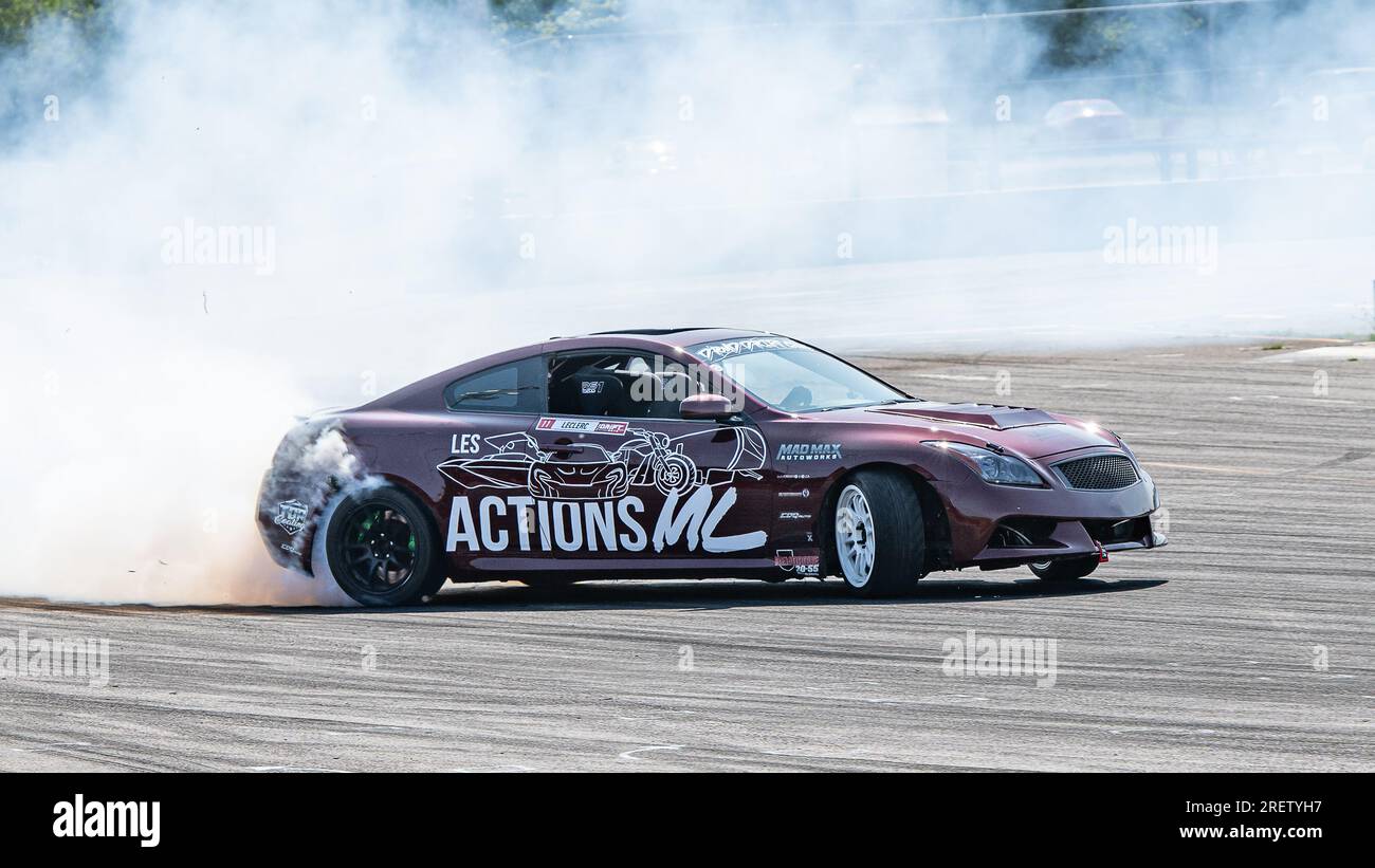 Car drifting auto racing event action with smoking tires - burning ...