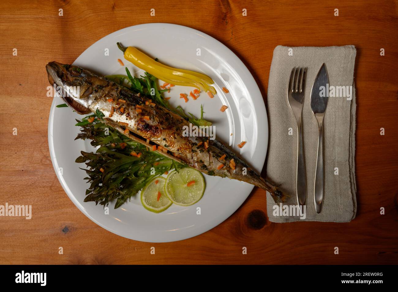 Grilled BBQ Mackerel with Chili, Lime and Coriander on a White Plate