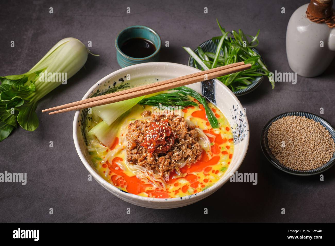 Stock photo of yummy noodles soup with minced meat isolated in grey background. Stock Photo