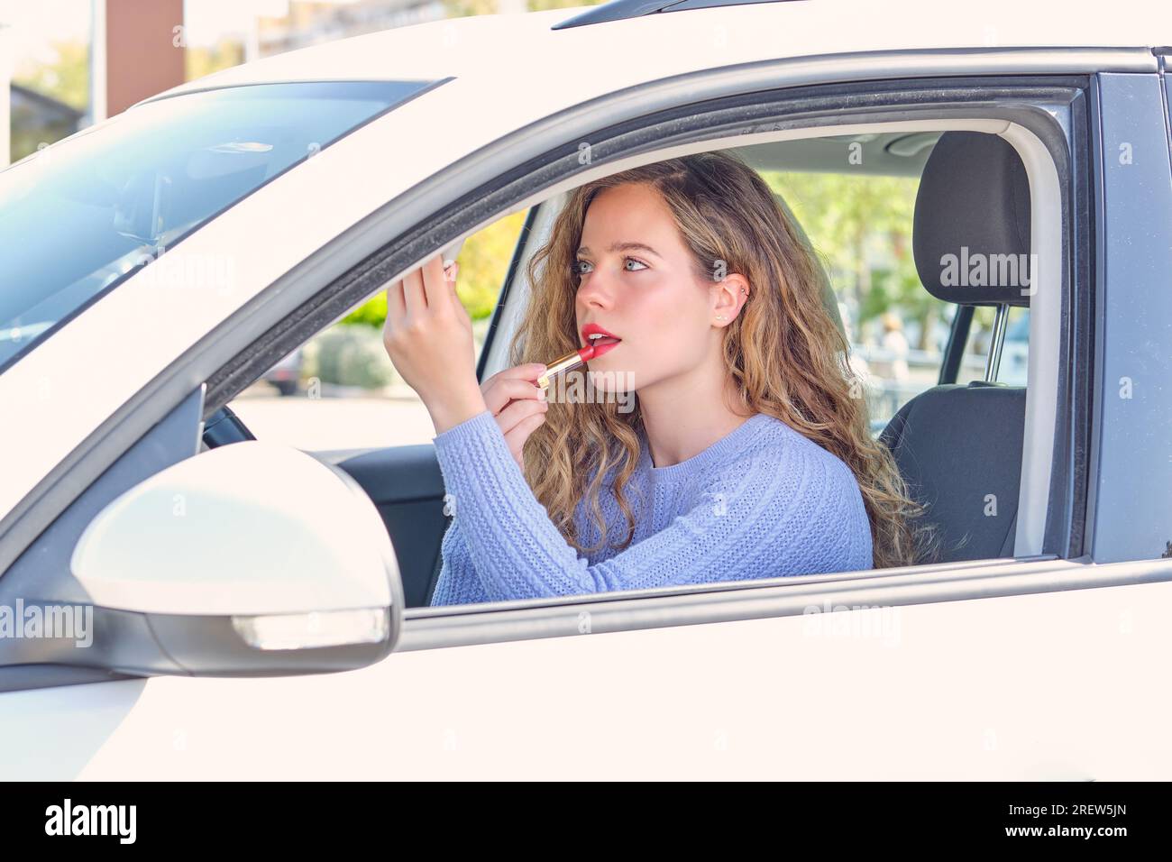 Woman applying lipstick in car hi-res stock photography and images - Page 2  - Alamy
