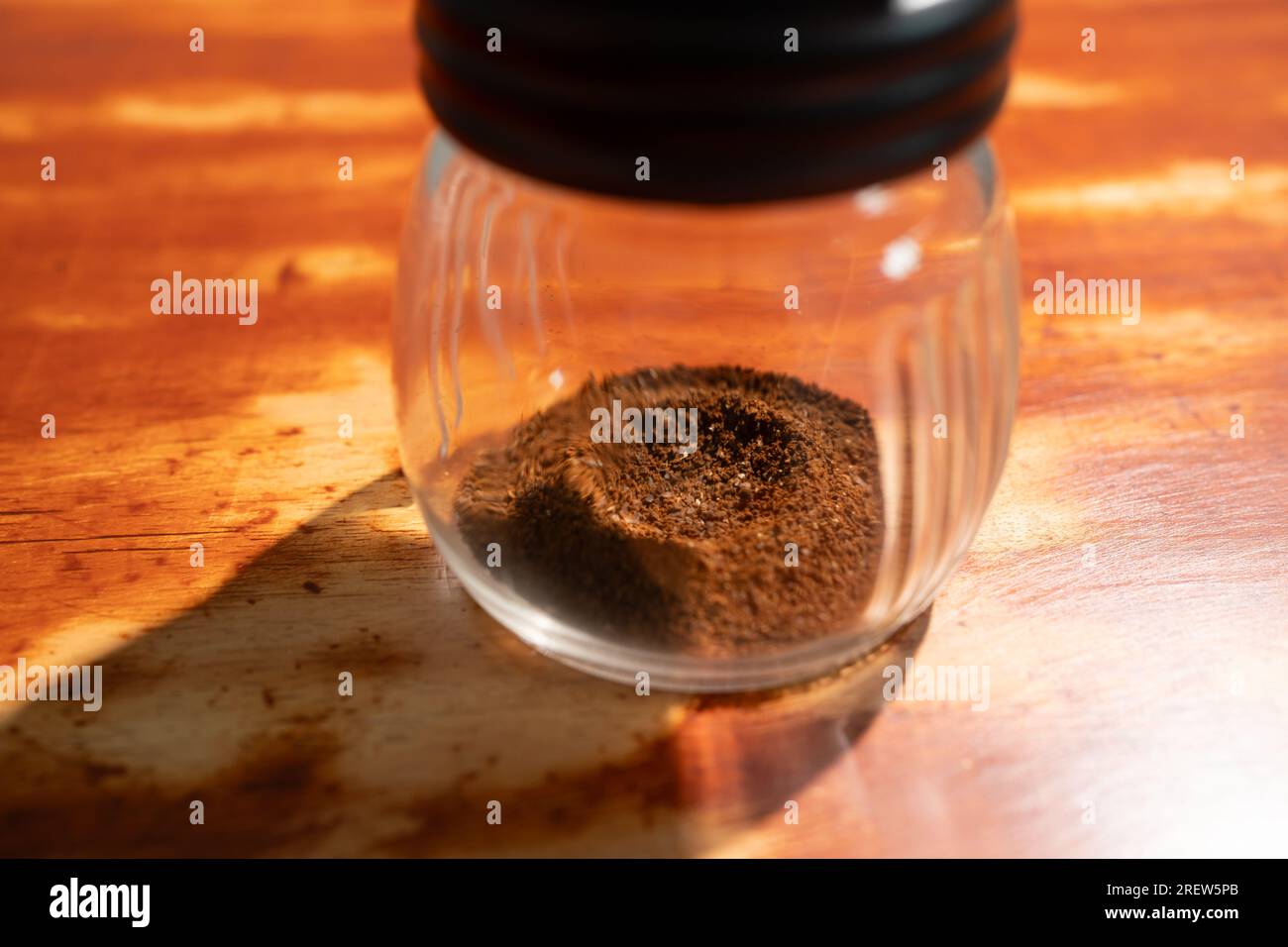 Ground coffee bean in a coffee grinder Stock Photo