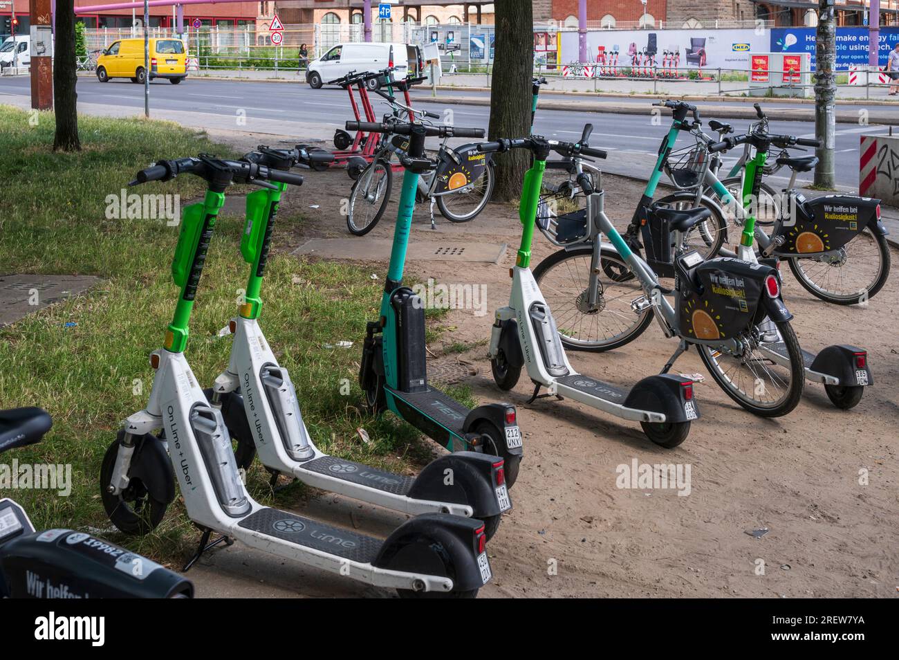 Germany , Berlin , 18.07.2023 , Electric scooters and rental bikes parked in Berlin Stock Photo
