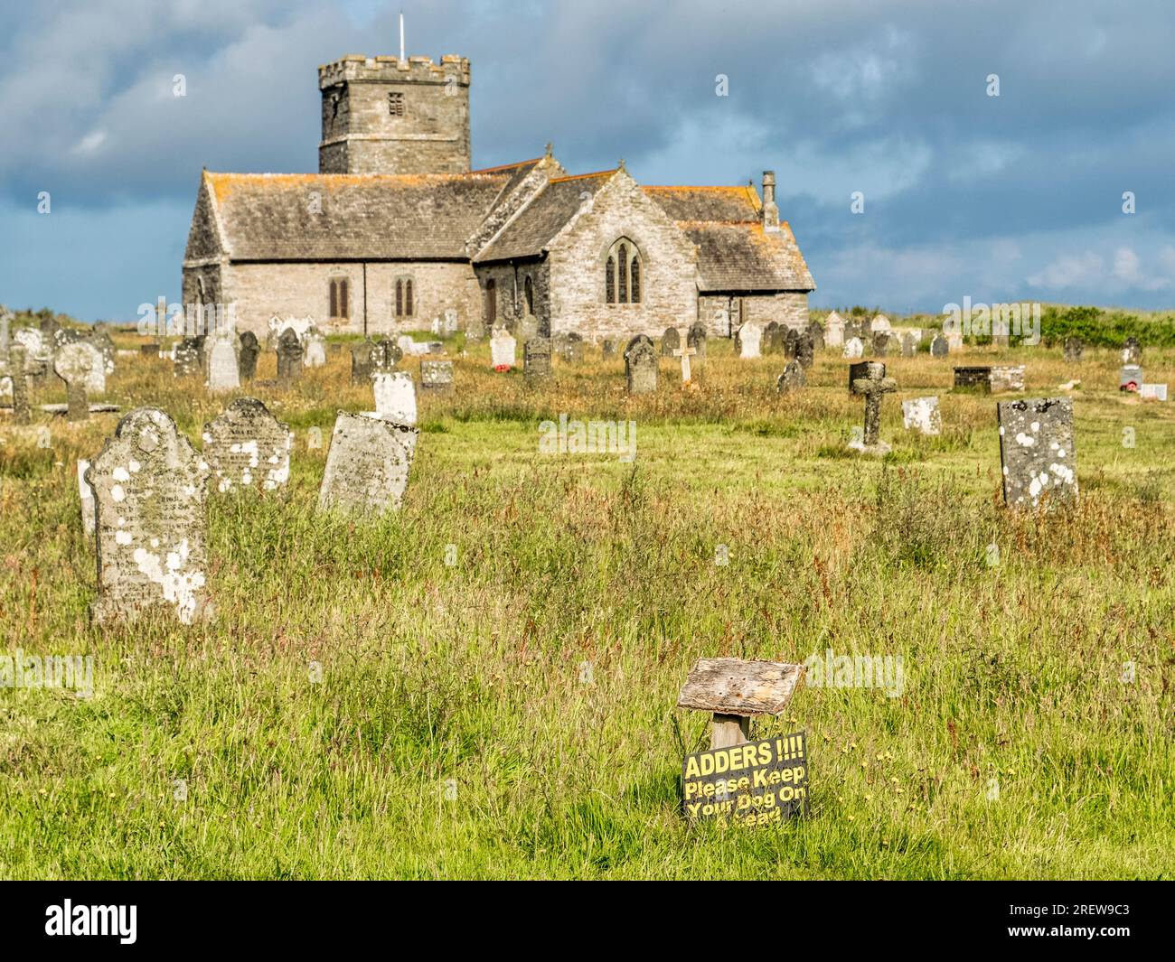 St Materiana's Churchyard, Tintagel, Cornwall, with sign warning of the presence of adders. Stock Photo