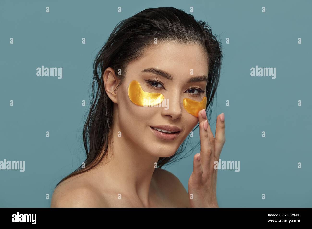 Well groomed girl applying under eyes mask with patches Stock Photo Alamy