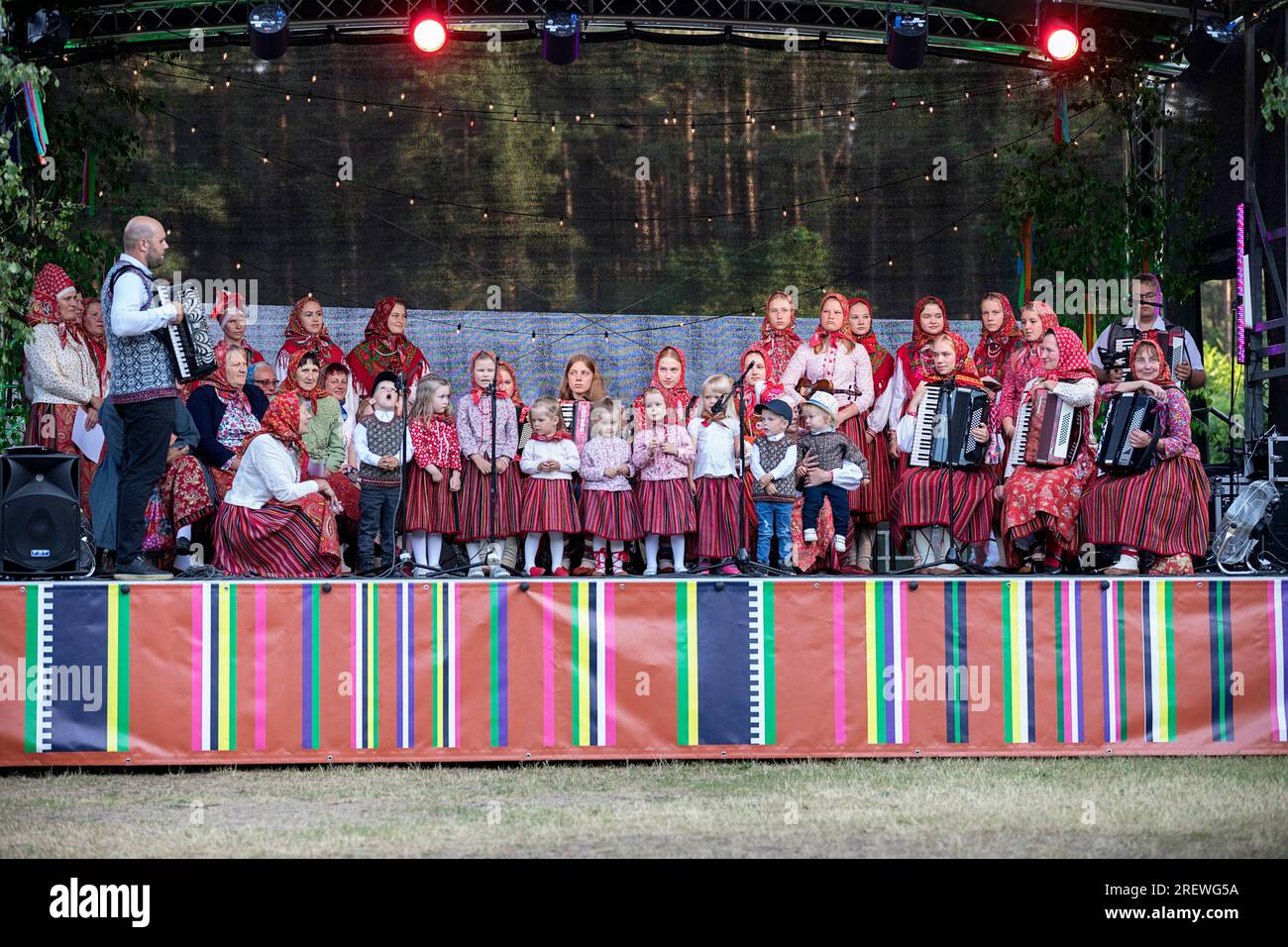 Locals in traditional estonian folk costumes celebrating on Jaanipaeva