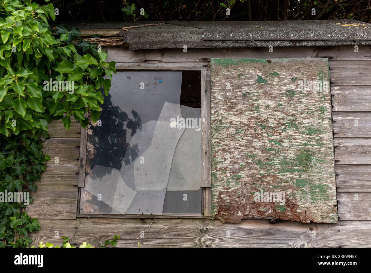 garden shed with broken window. garden shed in poor state of repair