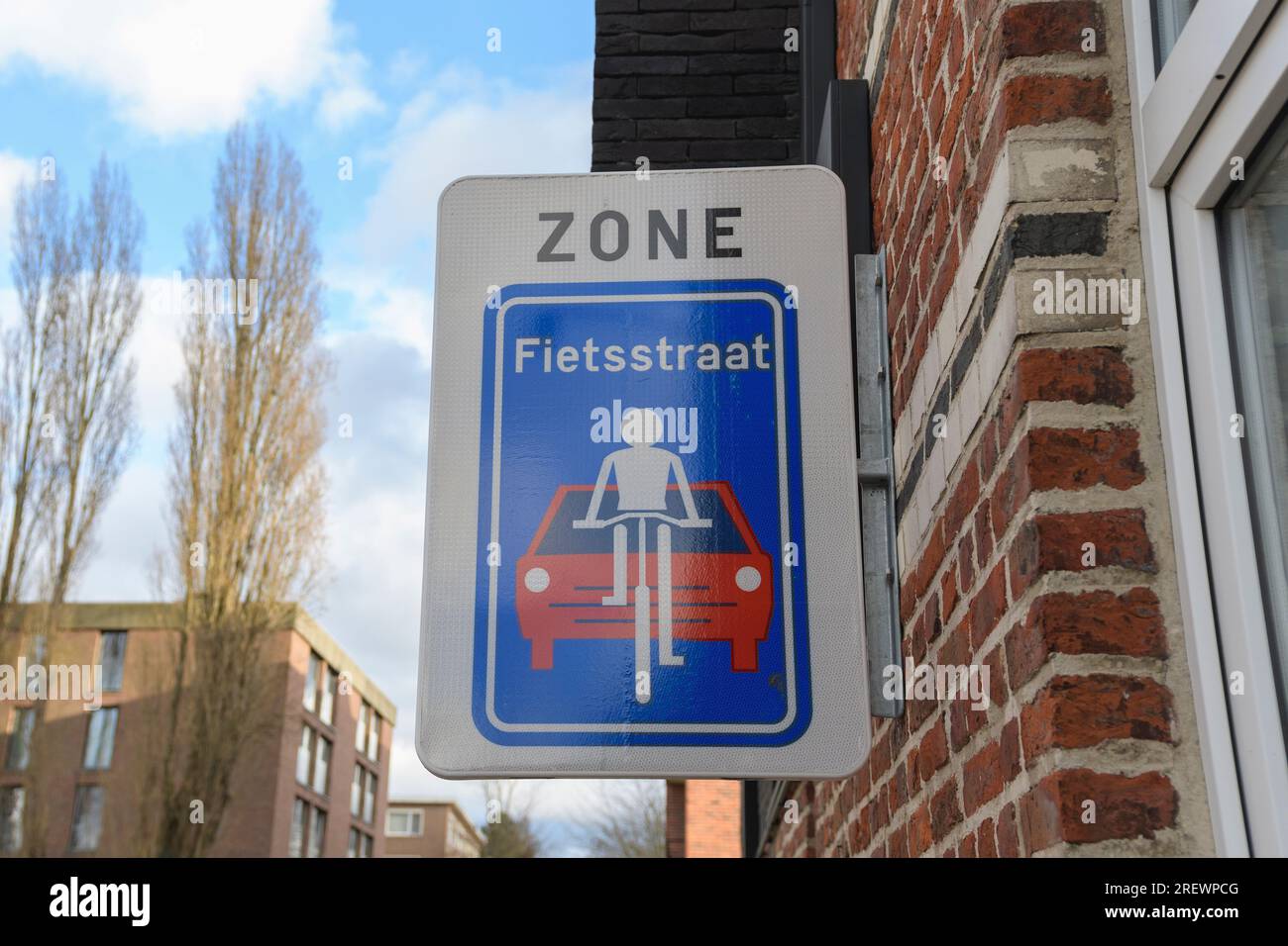 A cyclers road sign, meaning car may not overtake cyclers. Belgian regulatory road sign - Beginning of Fietsstraat Inscription in Dutch Stock Photo