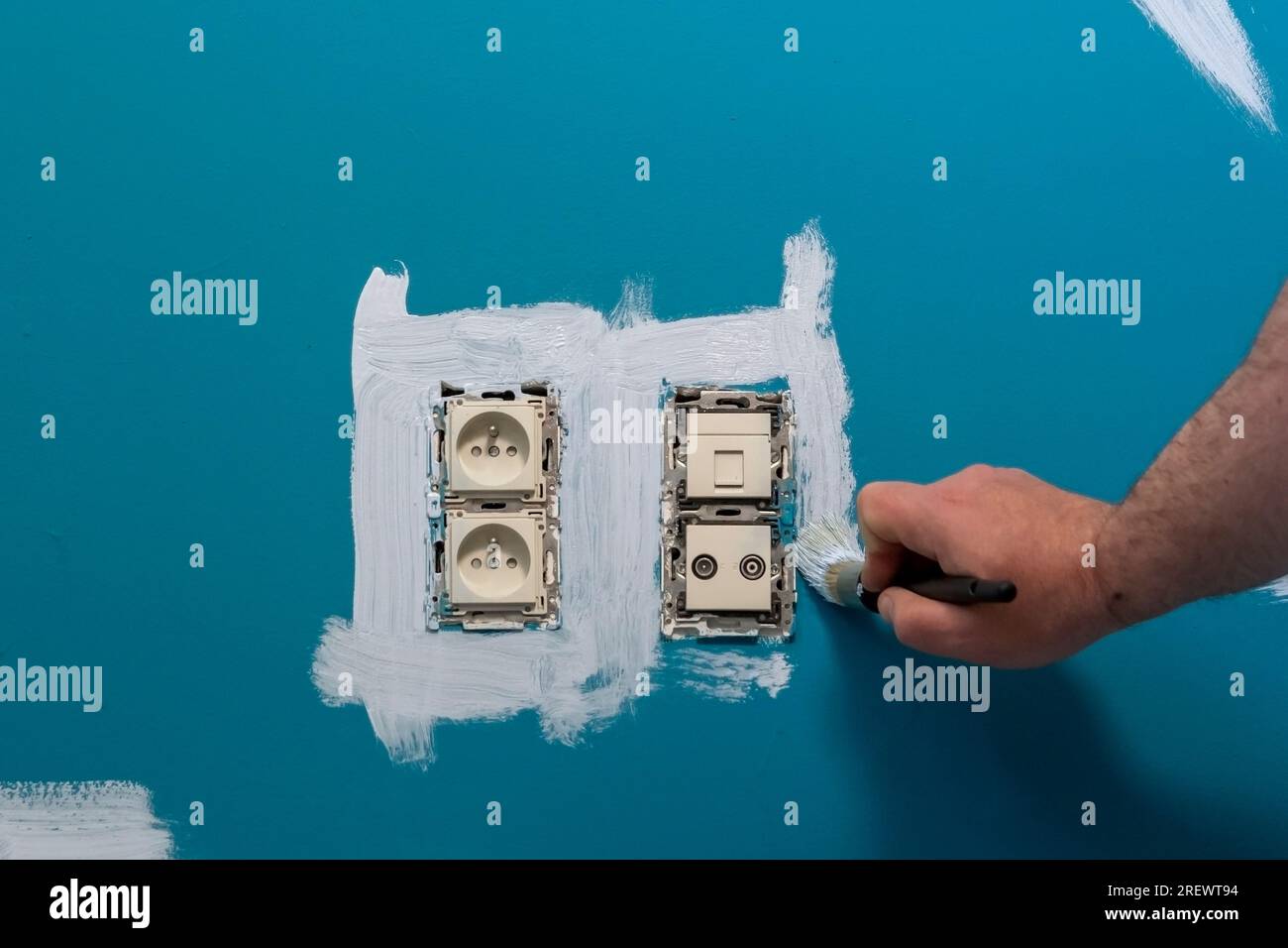 Wall painting around electrical outlets. removed power socket frame for