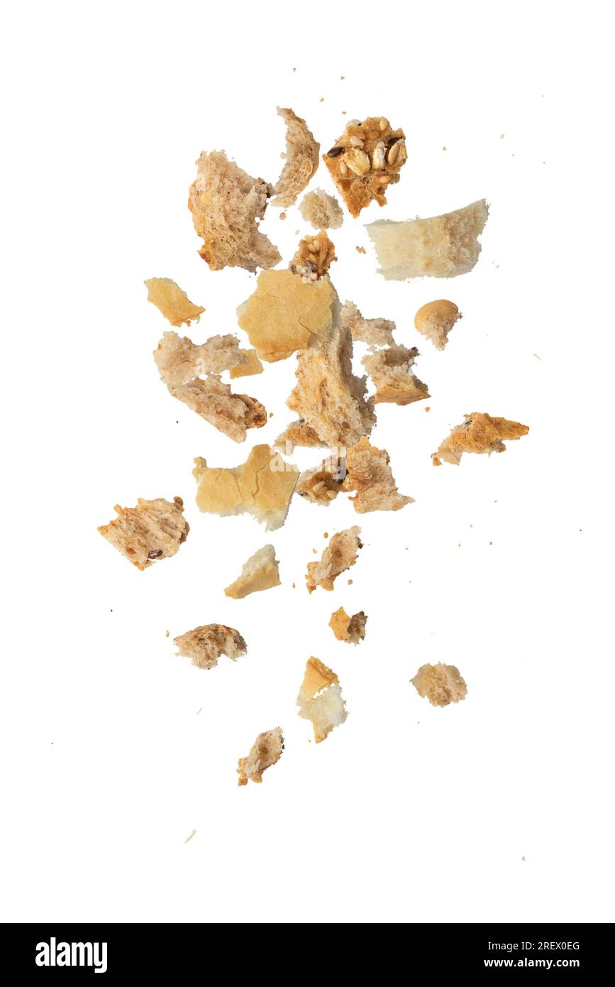 Flying crumbs. Crumbs of different bread on a white isolated background