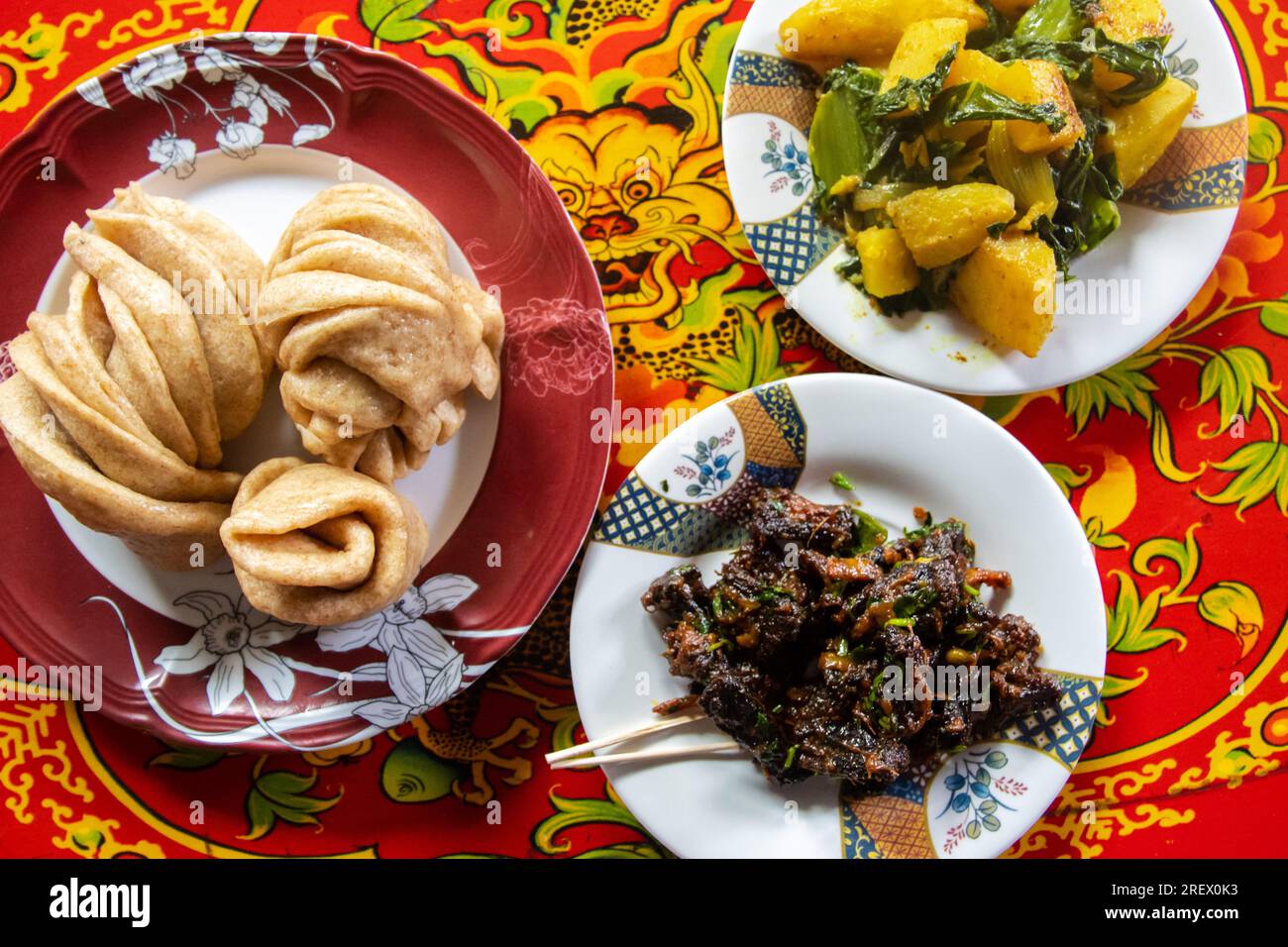 Tibetan Tim Momo with Potato Curry and Yak Jerky Sukuti, food of  Upper Mustang, Nepal Stock Photo