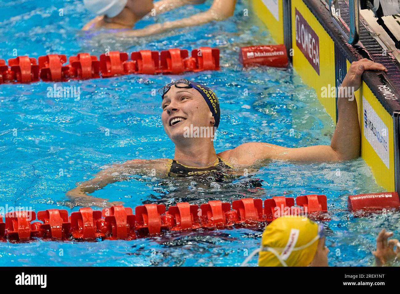 Sarah Sjoestroem, of Sweden, reacts after winning the women's 50meter