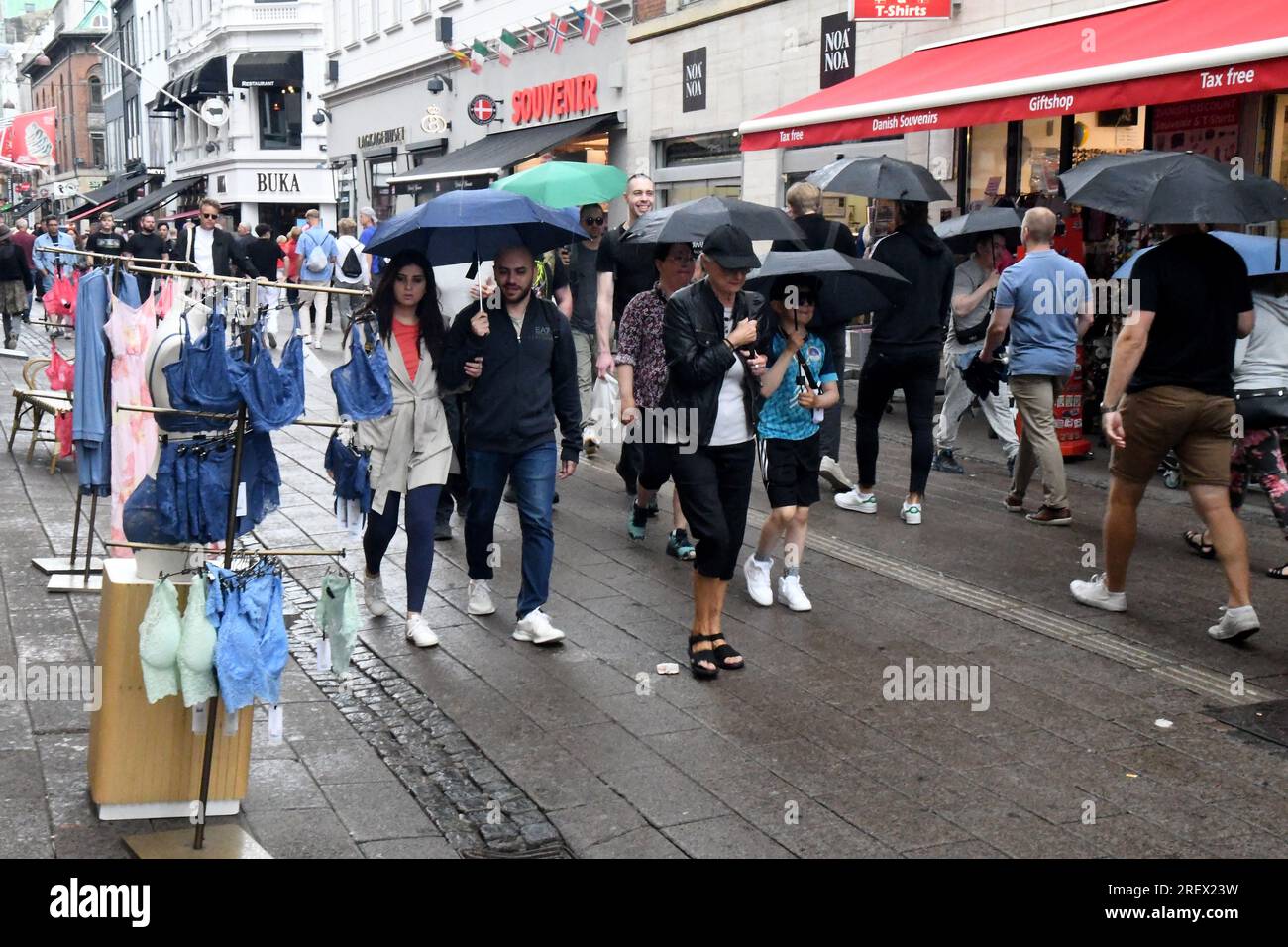 30 July 2023/ weather rain fall tourists and shoppers in rainy weather capital Copenhagen