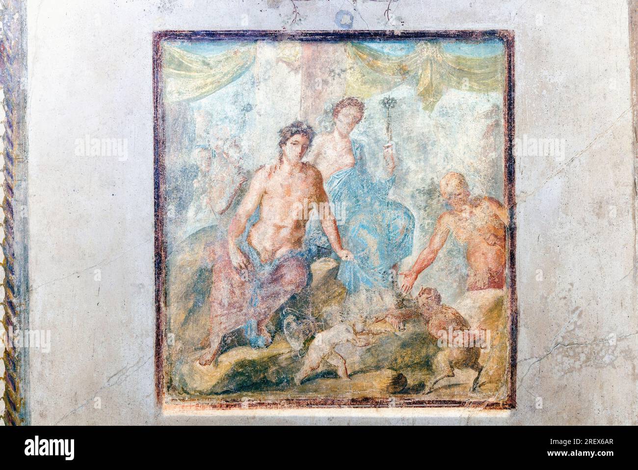 Pompeii Archaeological Site, Campania, Italy.  Fresco illustrating the Greek myth of the wrestling match between Pan and Eros watched by Dionysus, Ari Stock Photo