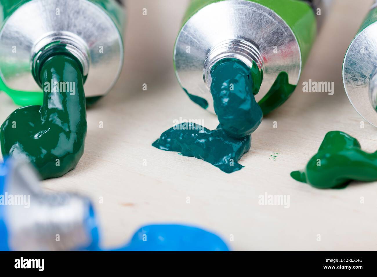 the creative process of drawing by using oil paints, tubes of oil paint