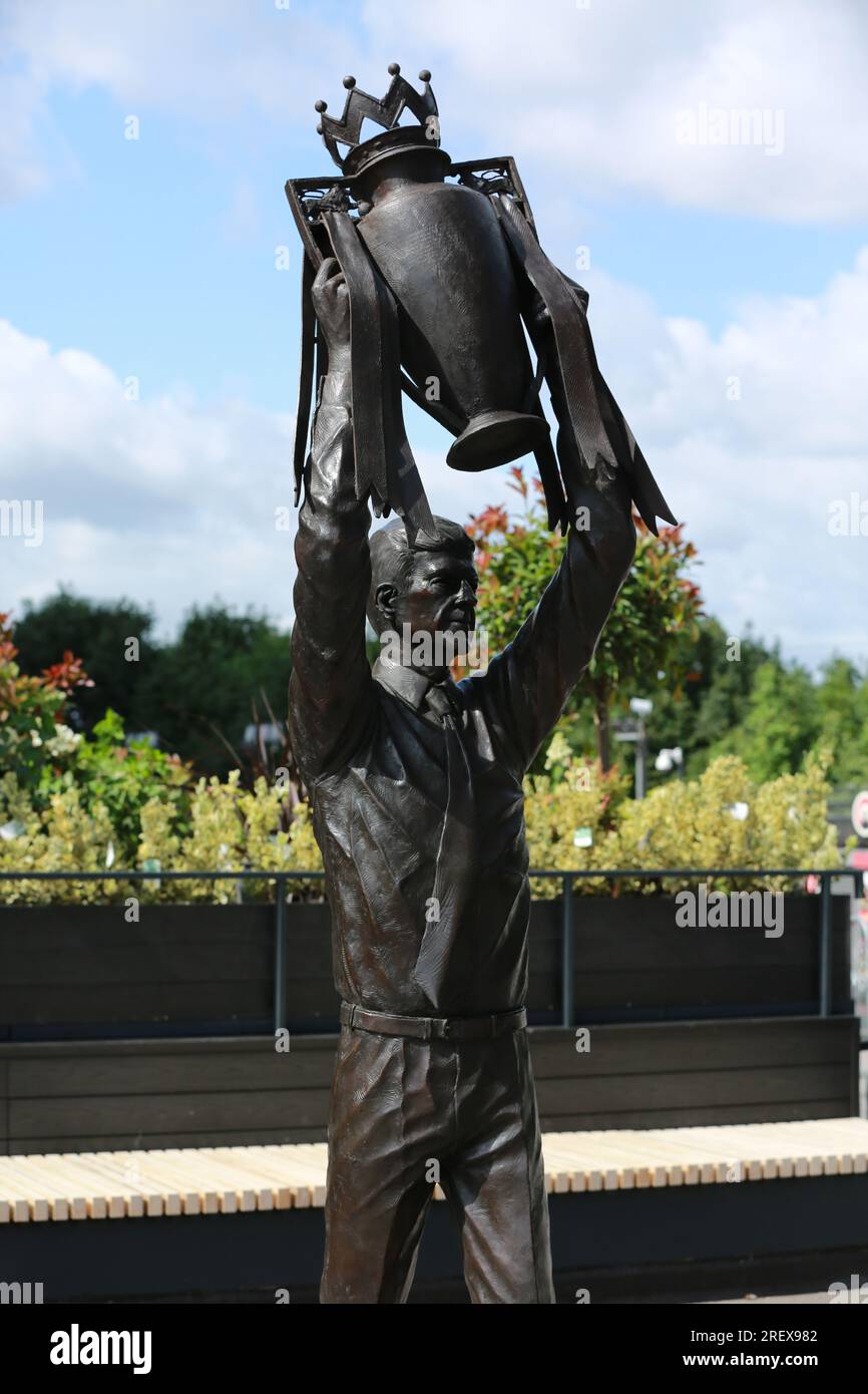 London, UK. 30 July 2023. Arsenal unveil Arsène Wenger statue outside the Emirates Stadium to commemorate the Gunners iconic manager's 22-year tenure at the club. The legendary manager led Arsenal FC to three Premier League titles, including the famous Invincibles season in 2003/04 where his side remained unbeaten, and seven FA Cups. The bronze statue, which was created by sculptor Jim Guy, is 3.5 metres high and weighs approximately half a tonne, and depicts the former French manager lifting the Premier League trophy. Credit: Waldemar Sikora/Alamy Live News Stock Photo