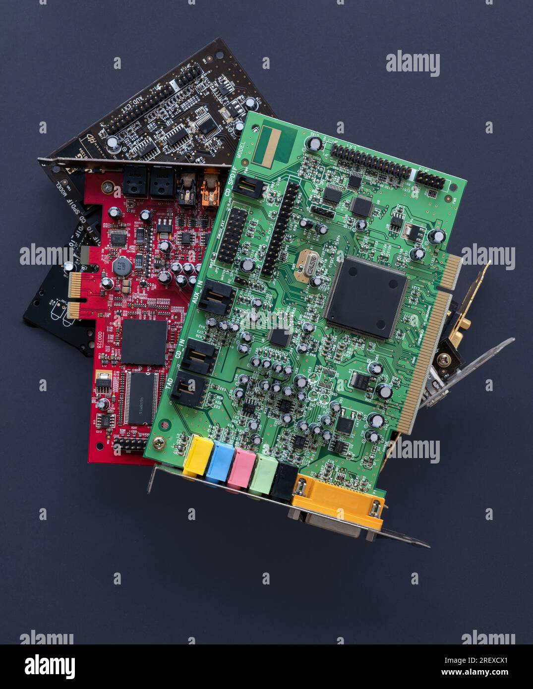 Collection of colourful internal sound cards. Black background. PC