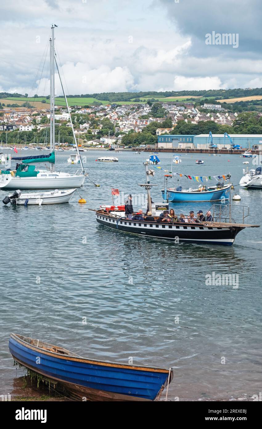 Teignmouth, England – July 21, 2023: The year round passenger ferry that crosses between the town and Shaldon on the opposite banks of the river Teign Stock Photo