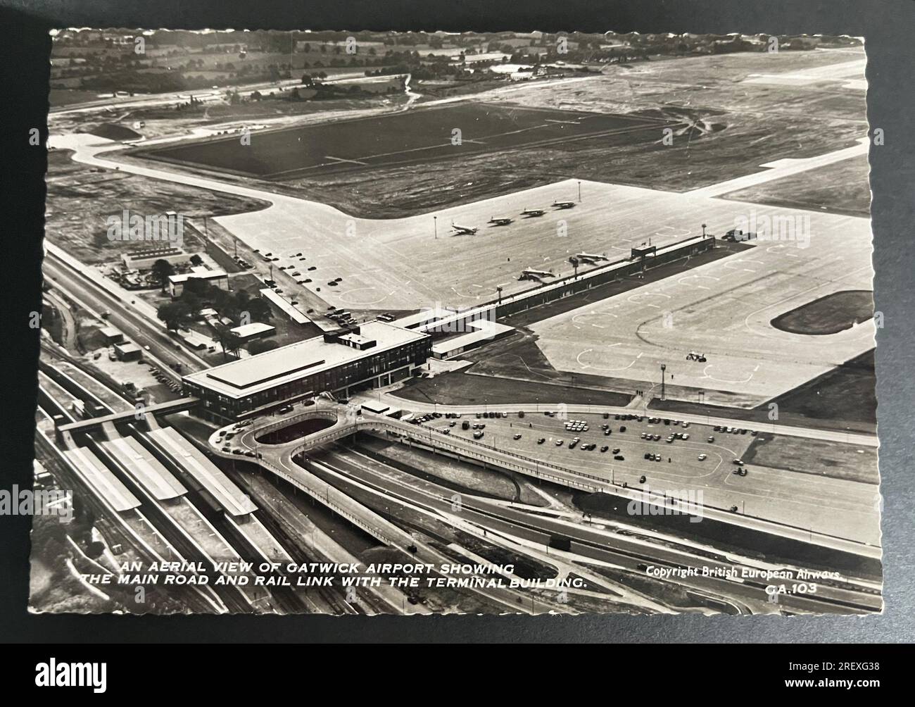 Vintage postcard of an aerial view of Gatwick Airport showing the main