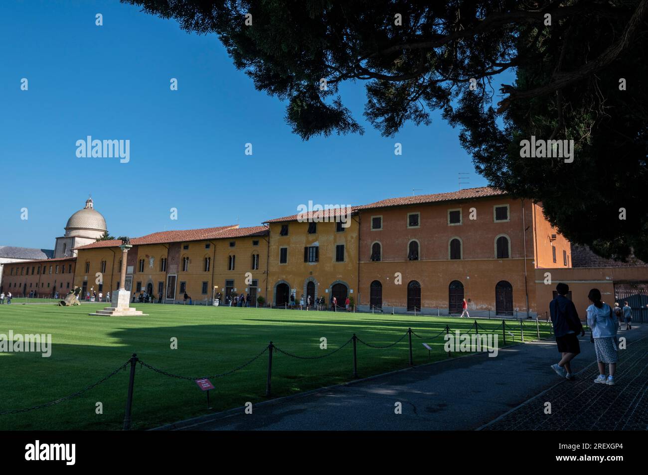 The long Campo Santo, also known as Camposanto Monumentale or Camposanto Vecchio, is a historical building behind the Cathedral on the Plazza Del Duomo Stock Photo