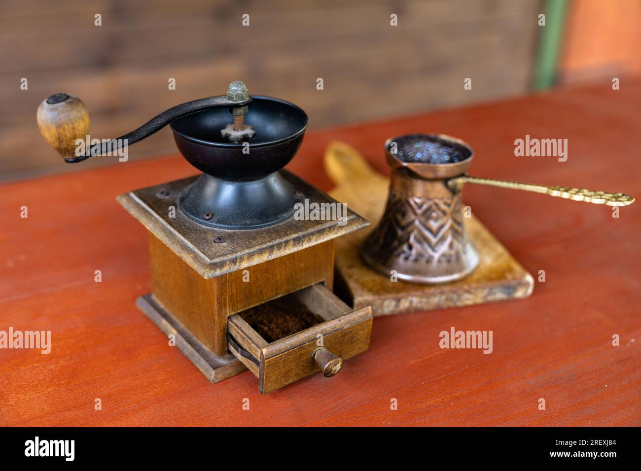 Vintage coffee pot and manual coffee grinder. Retro style of making