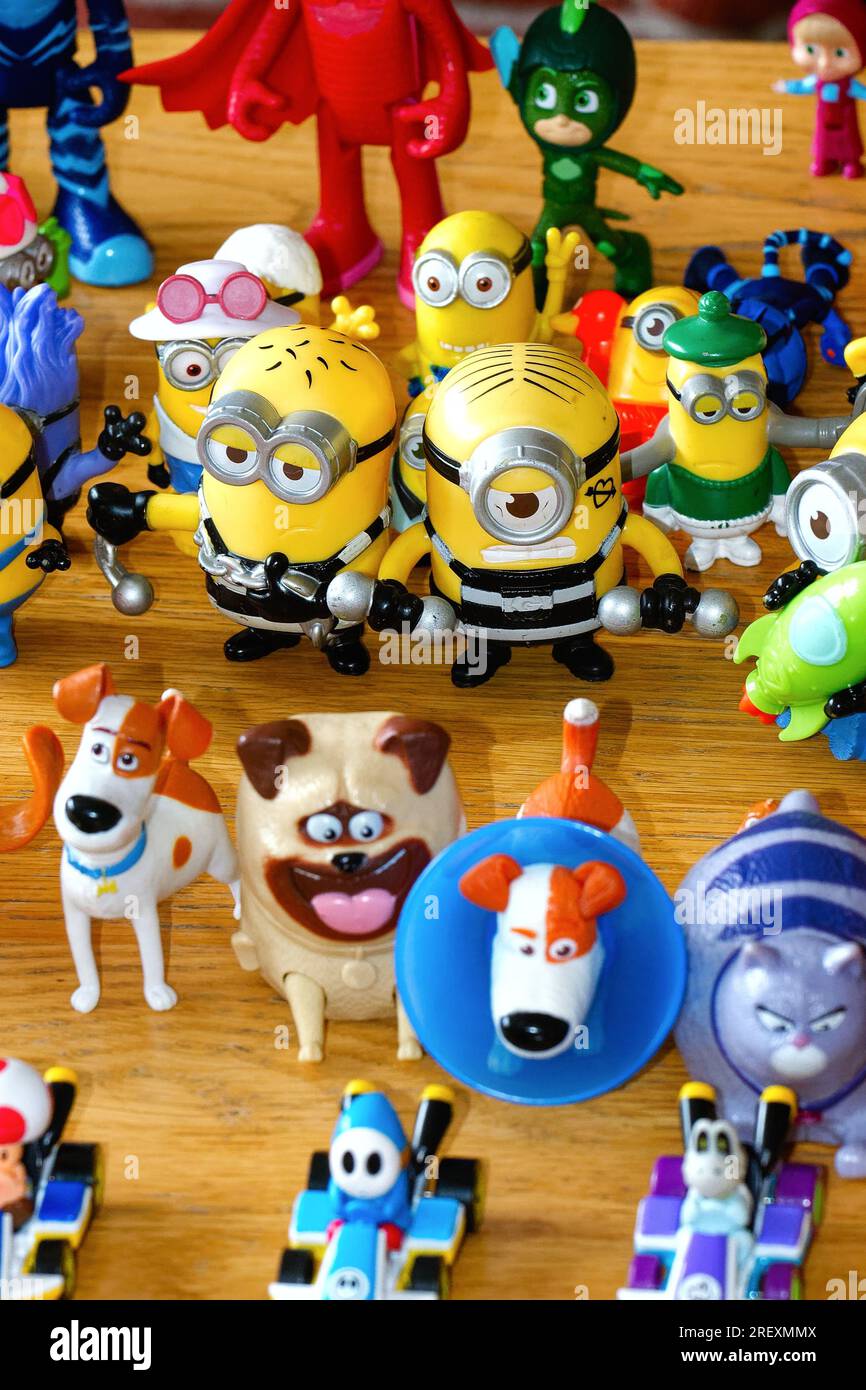 Close up of popular toy figures arranged in rows on a table top Stock Photo
