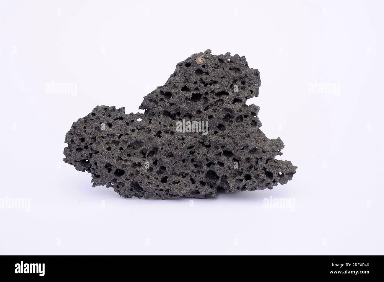 Vesicular basalt. Basalt is a volcanic or extrusive igneous rock. This sample comes from Lanzarote Island, Canary Islands, Spain. Stock Photo