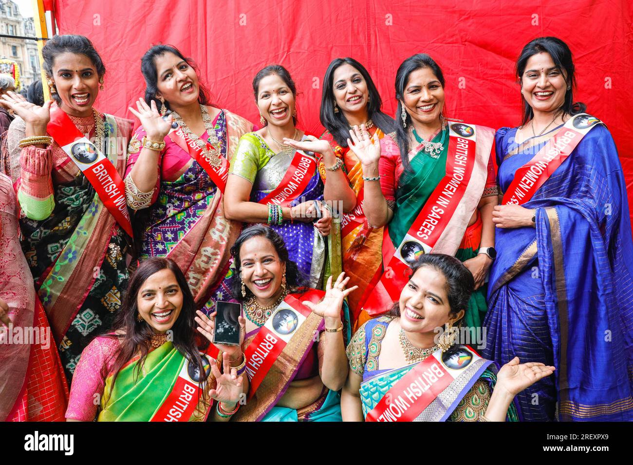 London, UK. 30th July, 2023. The cheerful ladies from 'British Women in Sarees', a group of empowered women showcasing their pride and patriotism by draping in their ‘saree' . London Rathayatra (which means chariot festival) is celebrated by devotees to Krishna. The celebration, which has a long tradition of several hundred years in India, annually commemorates the journey of the deities Lagannatha, Baladeva and Subhadra. A procession first sees thousands move to central London, followed by performances, festivities and food on on Trafalgar Square. Credit: Imageplotter/Alamy Live News Stock Photo