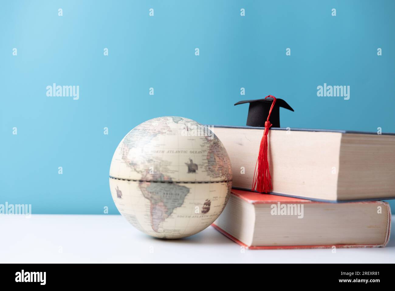 Graduation cap with Earth globe. Concept of global business study, abroad educational, Back to School, Study abroad business in universities. Elements Stock Photo