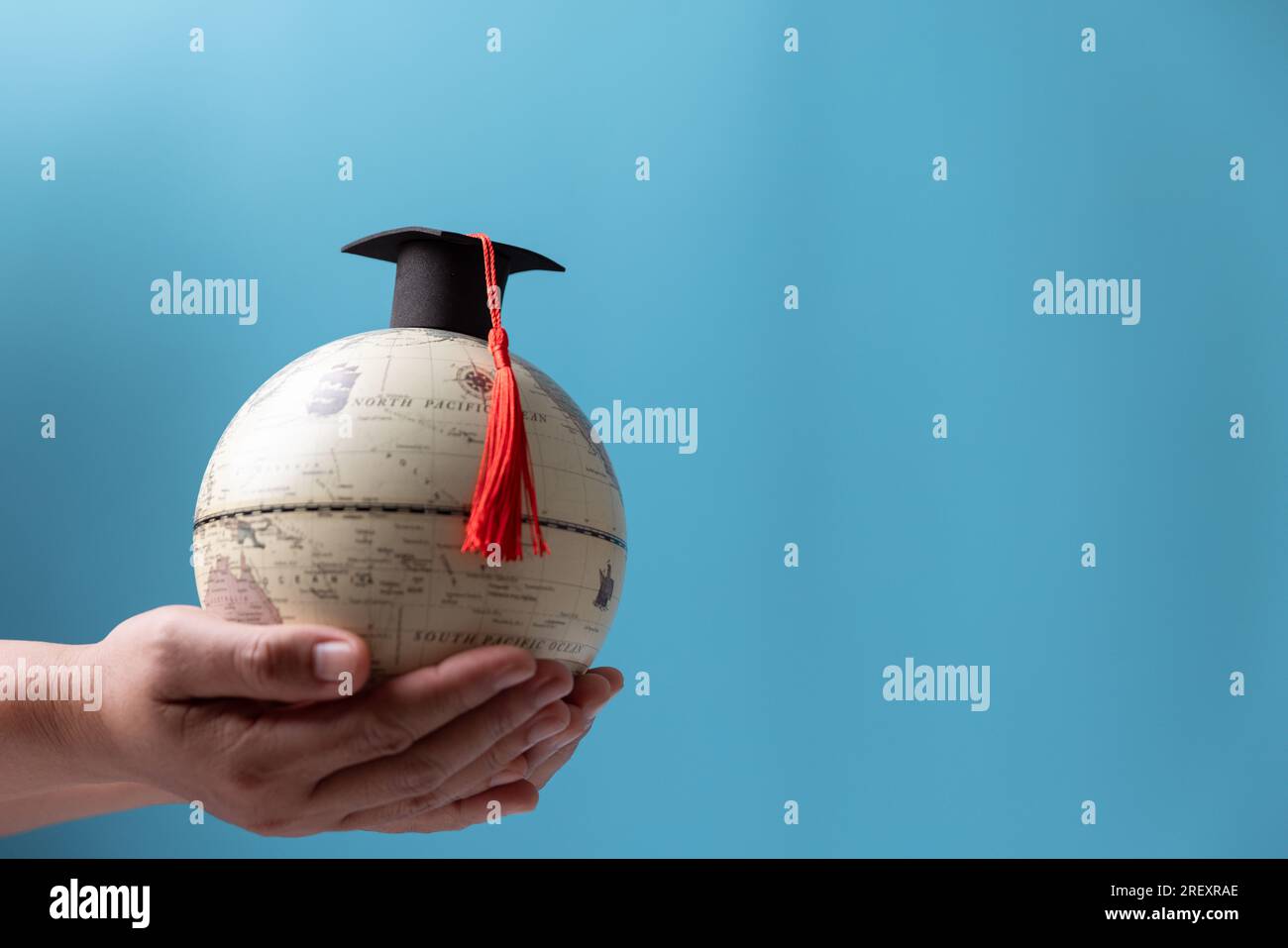 Graduation cap with Earth globe. Concept of global business study, abroad educational, Back to School, Study abroad business in universities. Elements Stock Photo