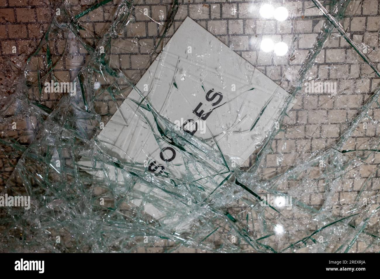 A window broken with a pay sign in the centre of Marseille, France ...