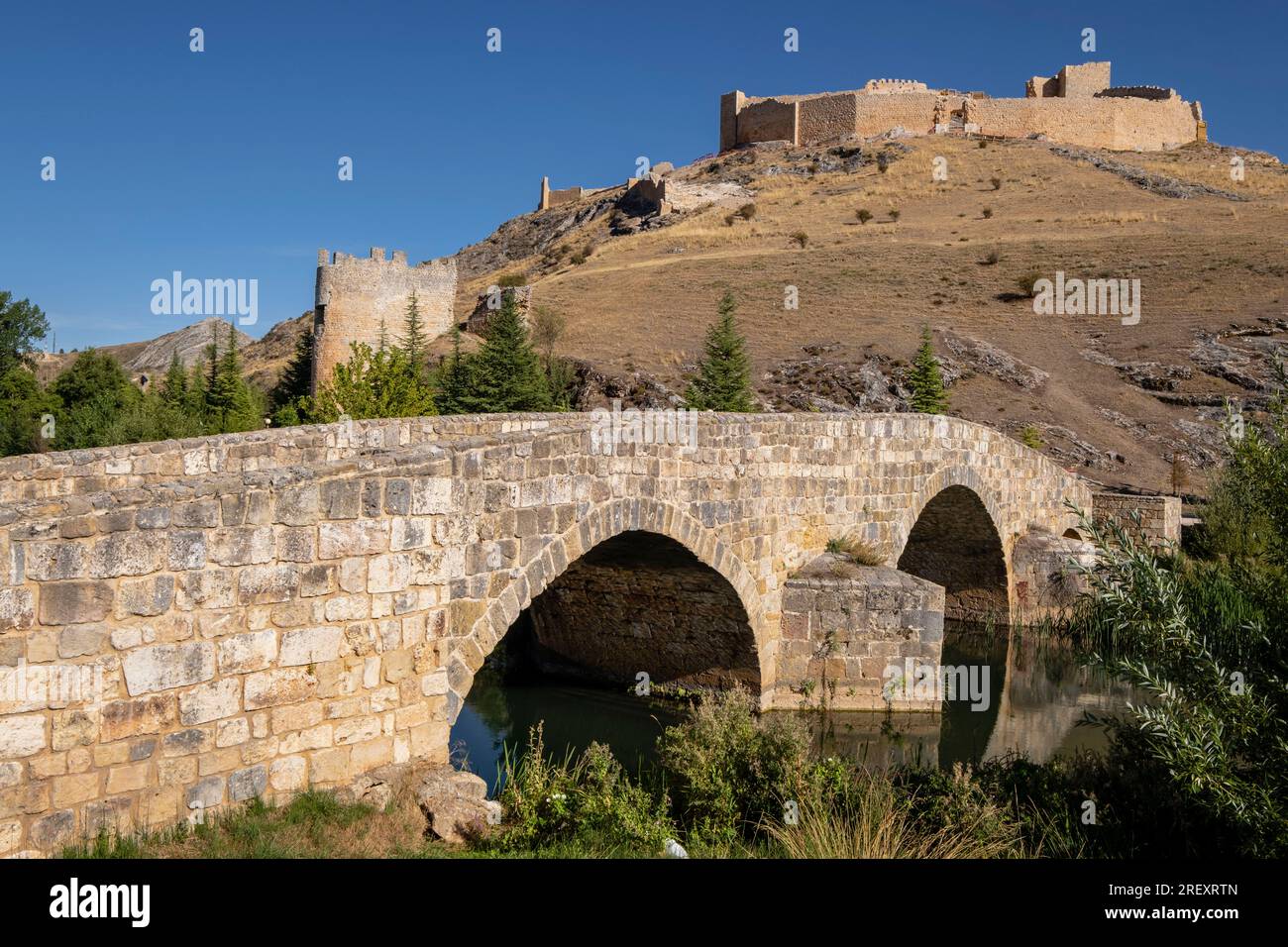 Roman bridge over the Ucero River and Osma Castle, El Burgo de Osma, Soria, autonomous community of Castilla y León, Spain, Europe Stock Photo