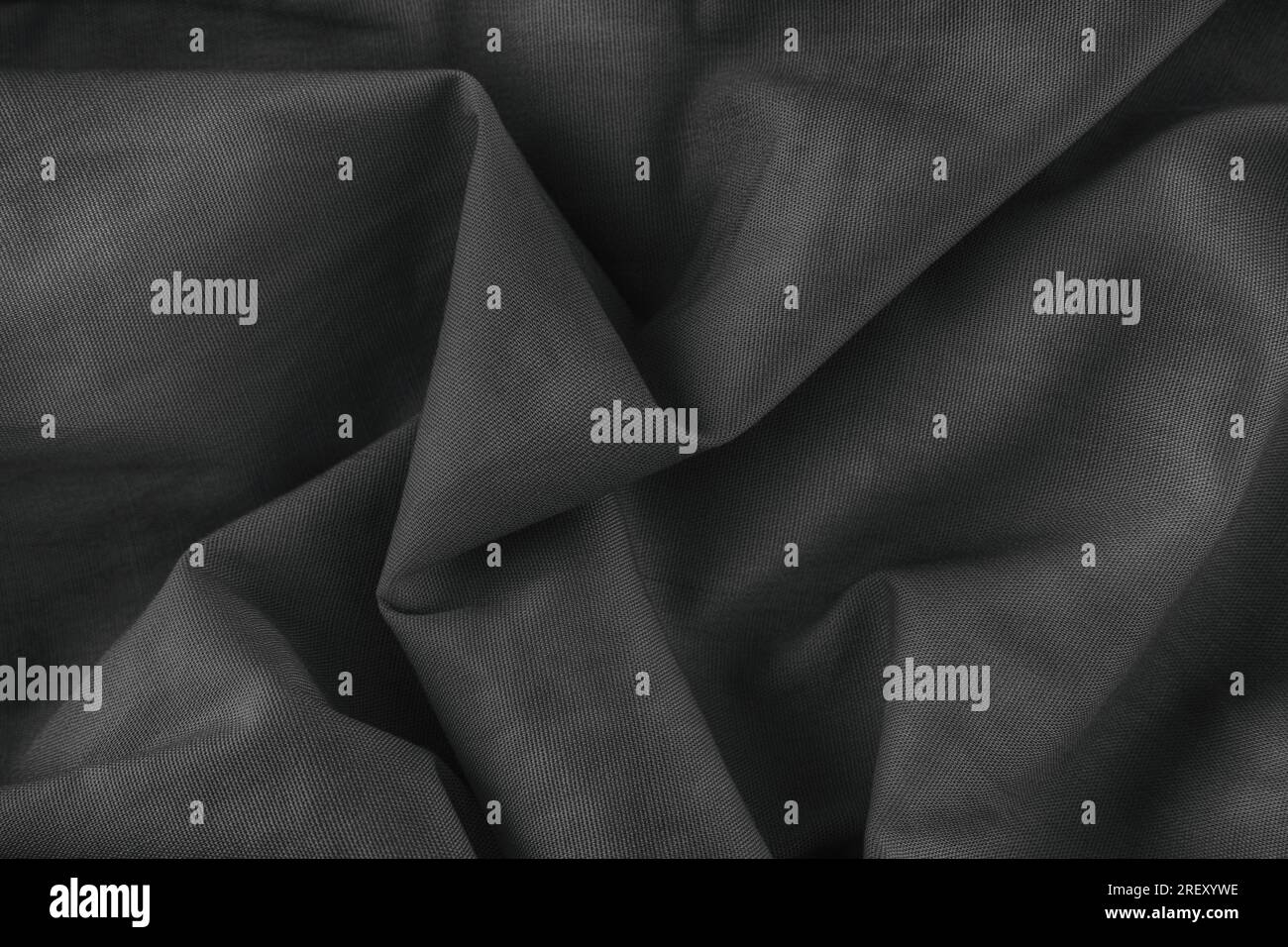 Folded fabric texture background. Black and white. Close up. Stock Photo