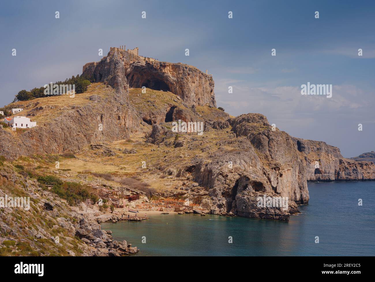 Rhodes, Greece. Lindos small whitewashed village and the Acropolis, scenery of Rhodos Island at Aegean Sea. St. Pauls bay Stock Photo