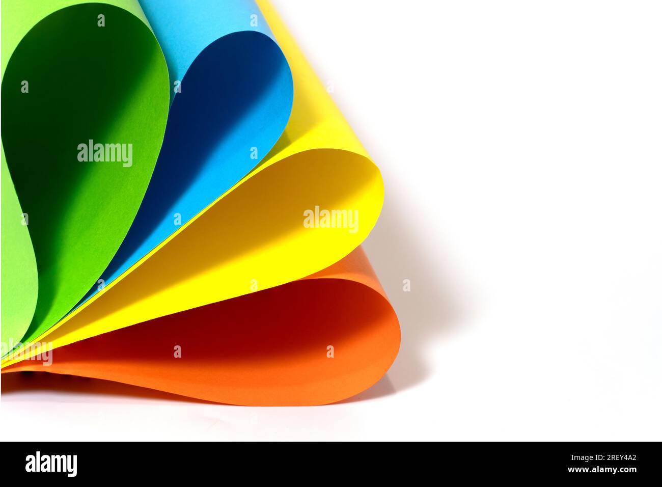 Abstract sheets rolls of multicolor paper on white background with copy space Stock Photo