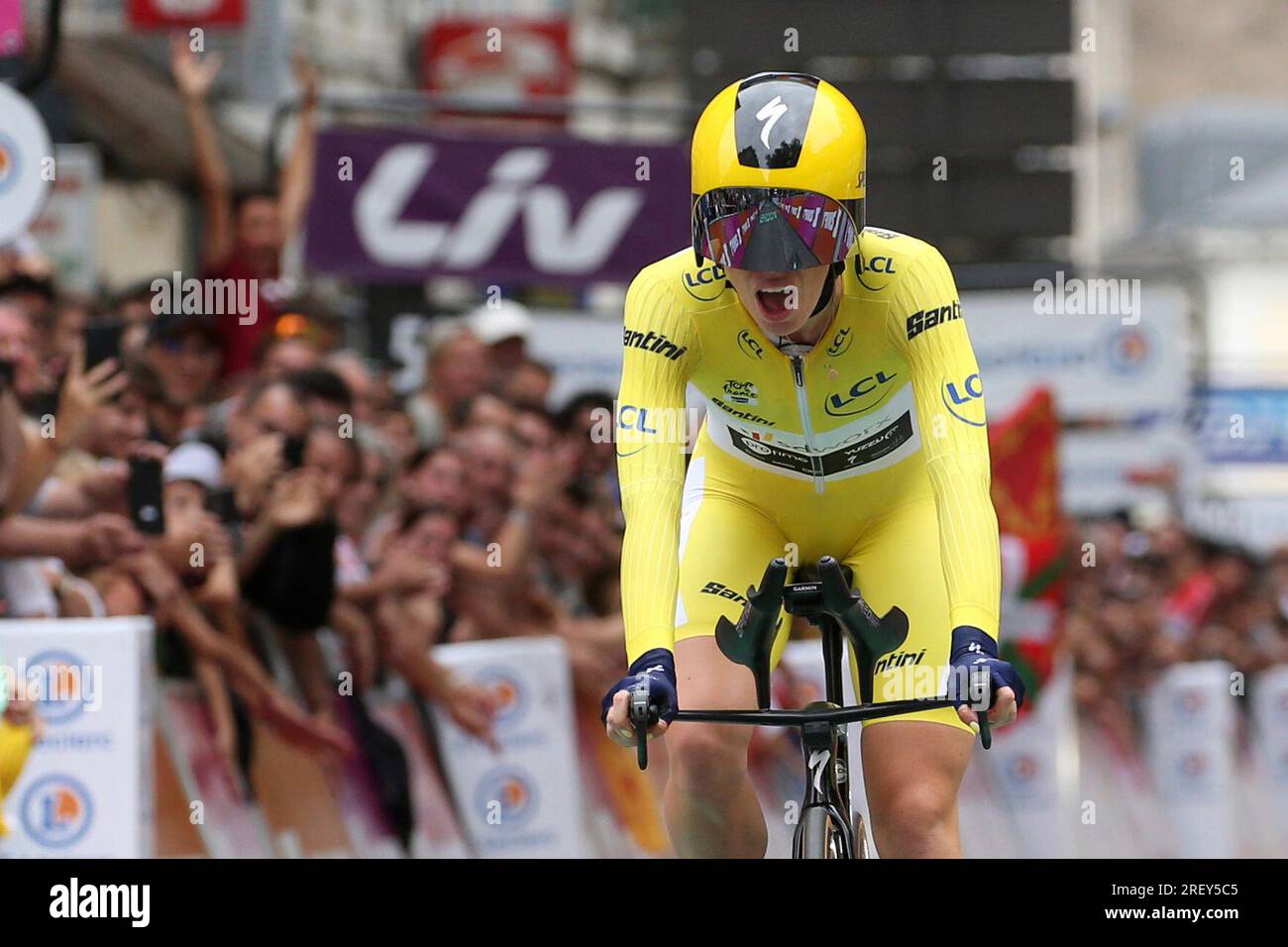 Netherland's Demi Vollering wearing the overall leader's yellow jersey crosses  the finish of the eighth stage of the Tour de France women's cycling race,  an individual time trial over 22.6 kilometers (14