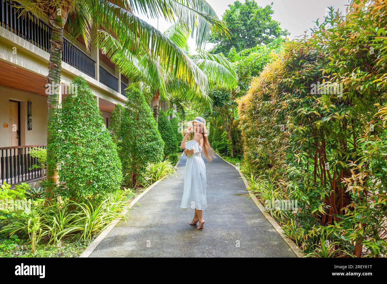 Young woman walks among trees hi-res stock photography and images - Alamy