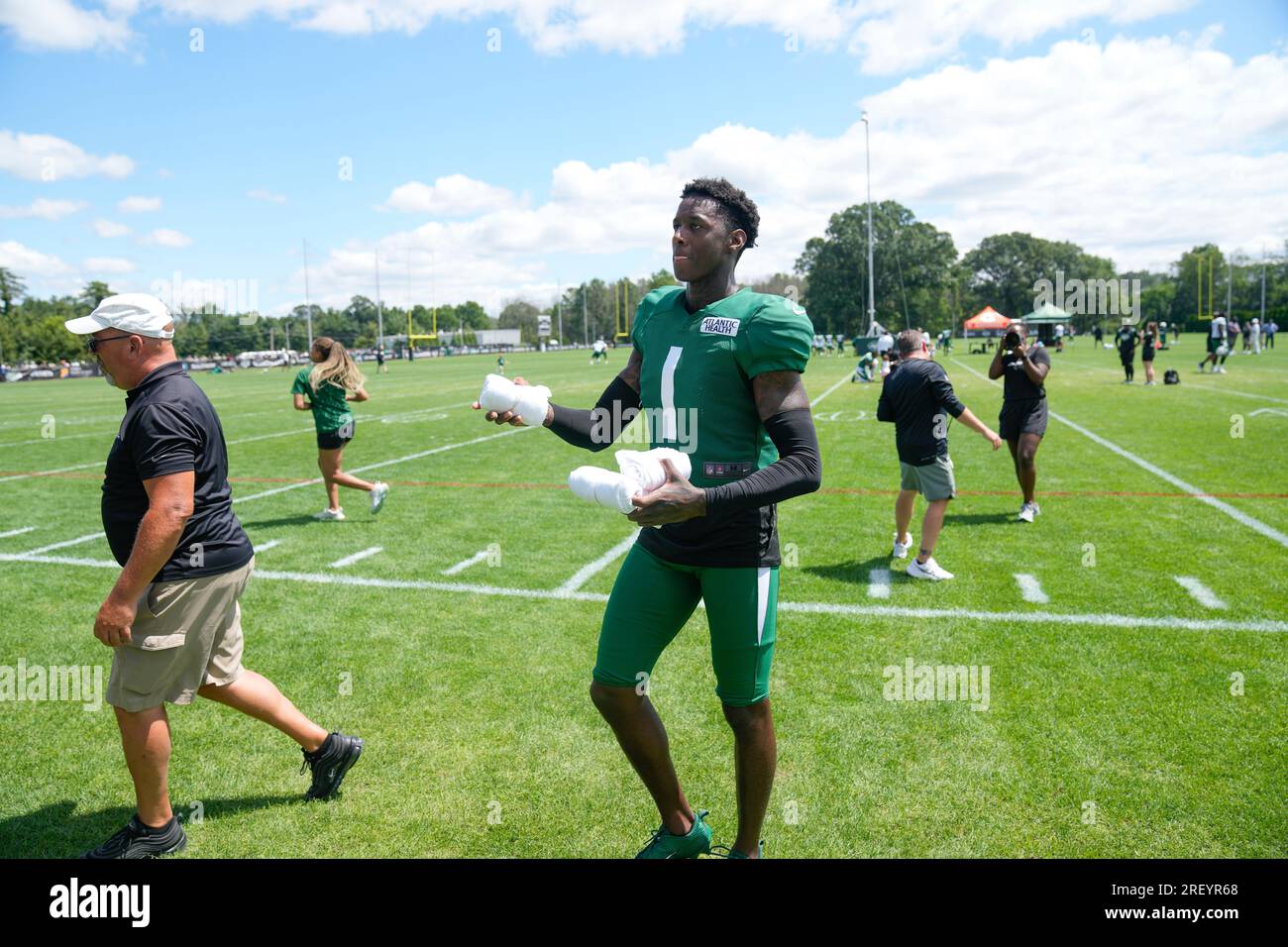 New York Jets' Sauce Gardner throws T-shirts to fans after a practice at  the NFL football team's training facility in Florham Park, N.J., Sunday,  July 30, 2023. (AP Photo/Seth Wenig Stock Photo 