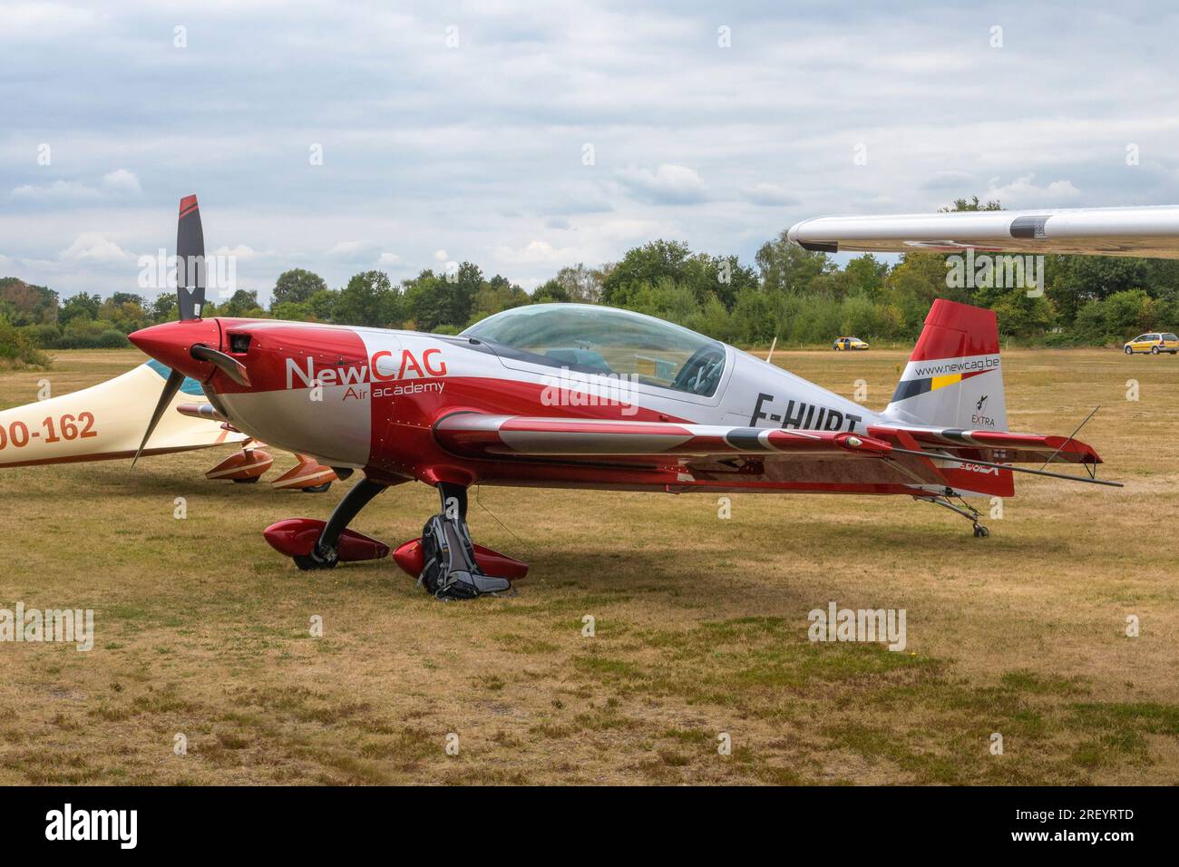 Hasselt. Limburg - Belgium 27-08-2022 Extra 330LX - F-HURT. Outdoor public show of vintage aircraft on the grass airfield at the Hasselt Aero Club. Re Stock Photo