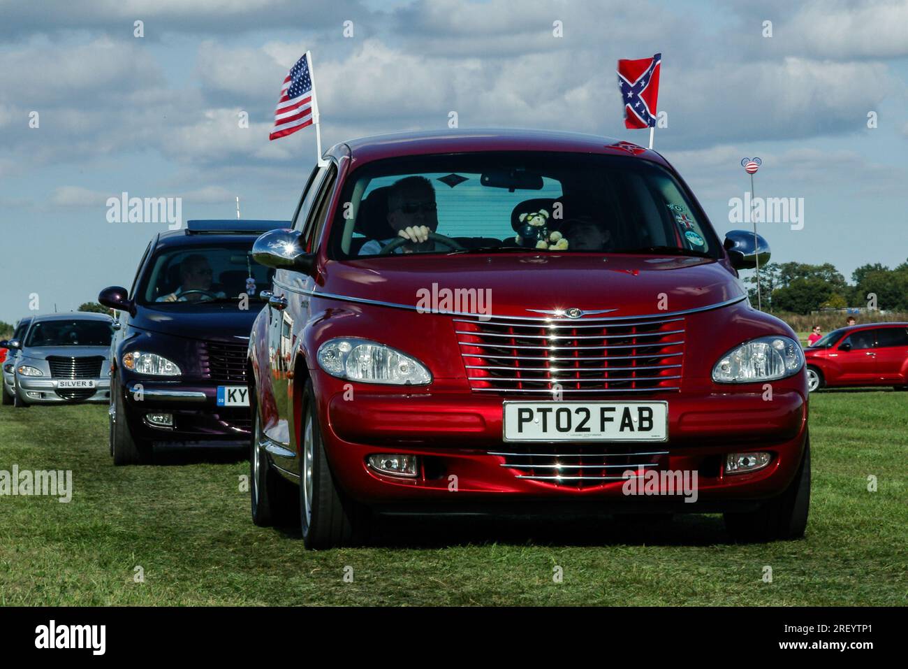 Chrysler PT Cruiser cavalcade at a wings and wheels event at Turweston Aerodrome in Buckinghamshire, UK. PT Cruiser automobile car enthusiasts Stock Photo