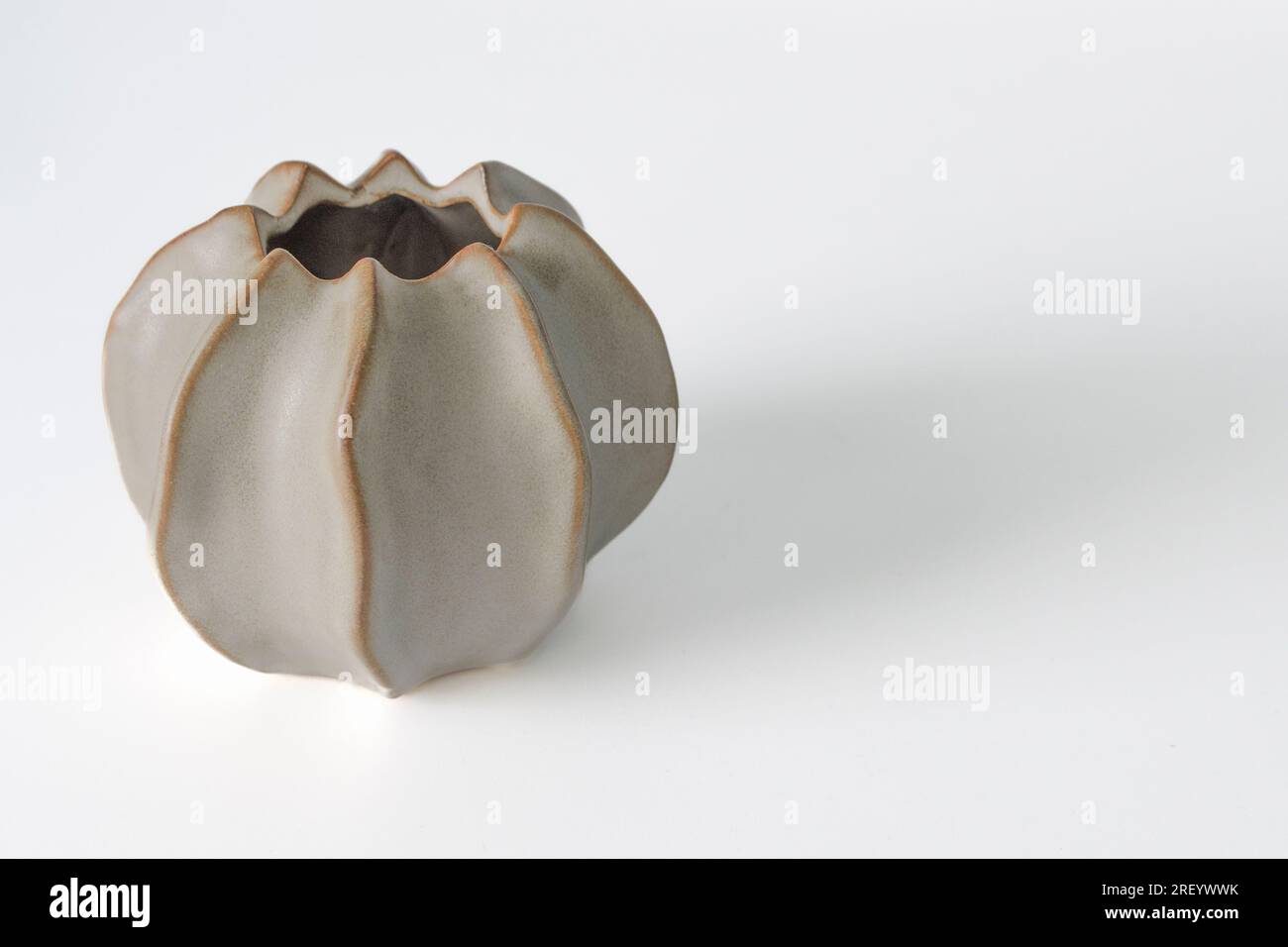 Ordinary cheap ceramic vase made in the shape of a bud. Simple form. On