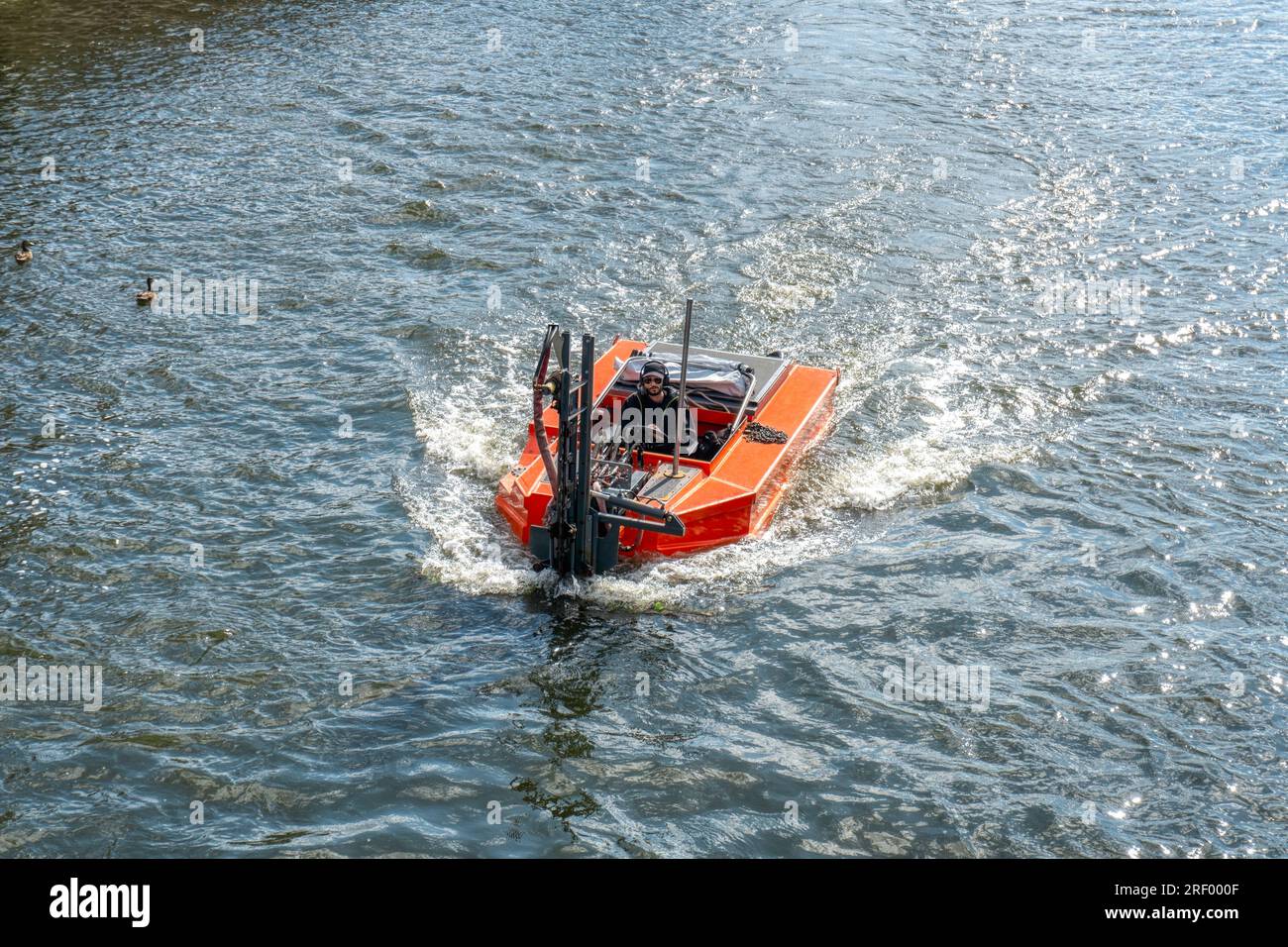 UK, Bedford, 7 July 2023, pusher boat weed cutter going on the river  in Bedford City of England Great Britain of UK Stock Photo