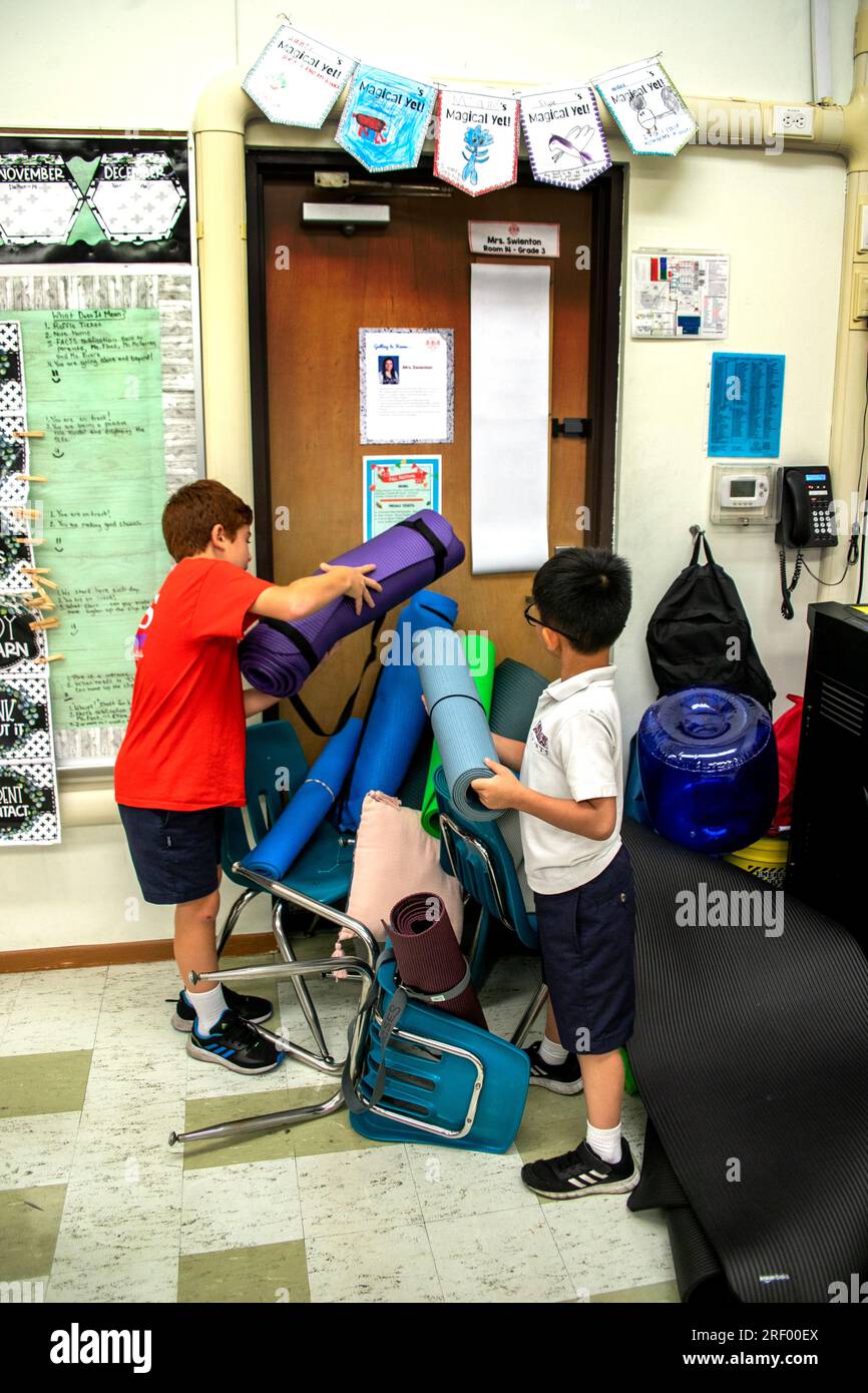 Students at a Southern California Catholic middle school practice barricading their classroom door in anticipation of an armed intruder. Stock Photo