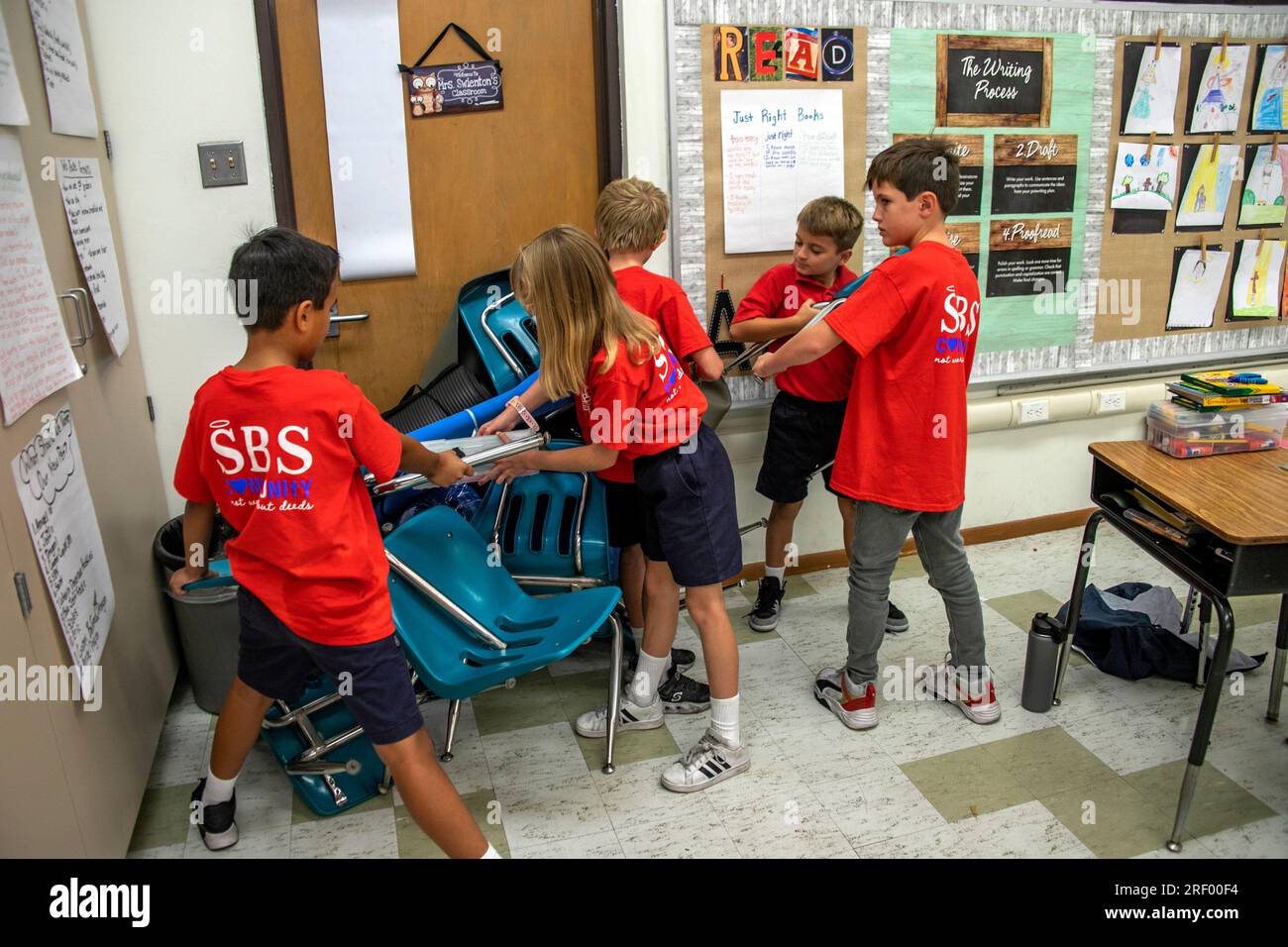 Students at a Southern California Catholic middle school practice barricading their classroom door in anticipation of an armed intruder. Stock Photo