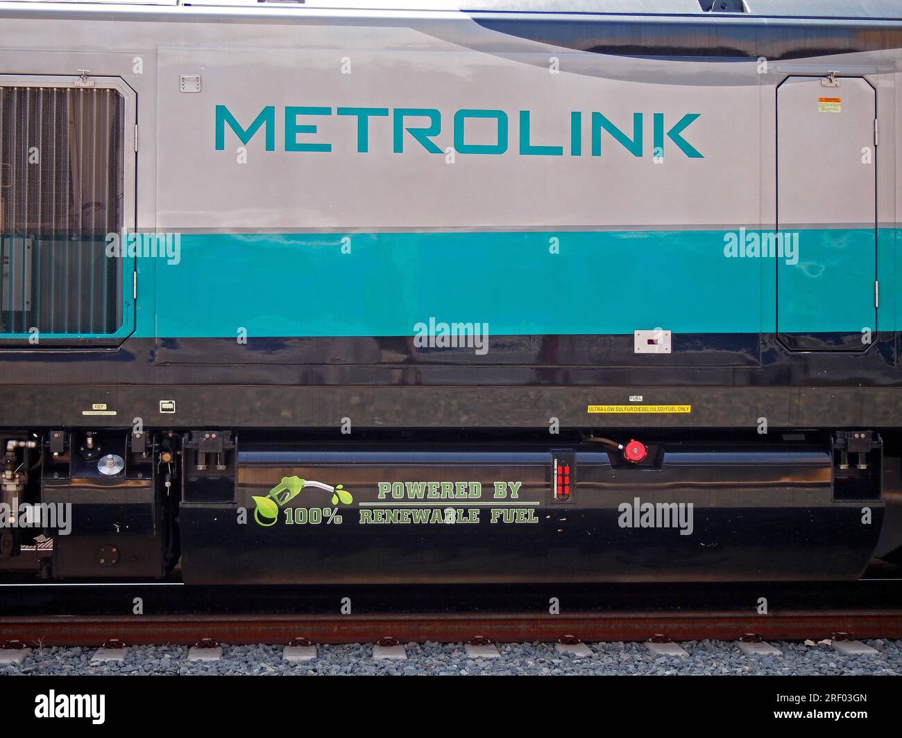 POWERED BY RENEWABLE FUEL sign on side of a Metrolink train engine, at