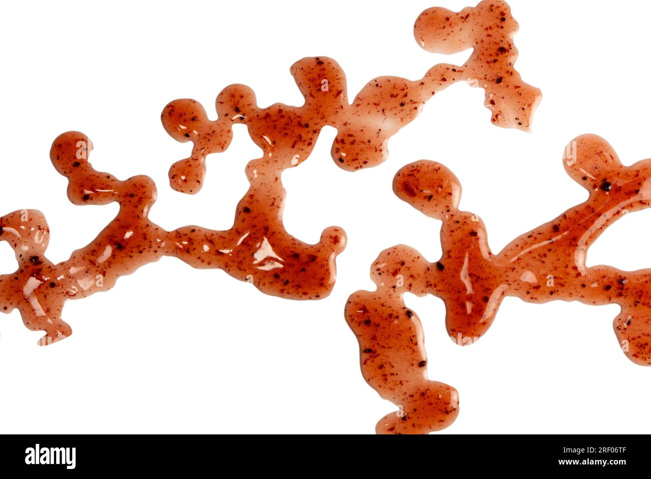 Red jam splashes isolated on a white background. Top view. Stock Photo