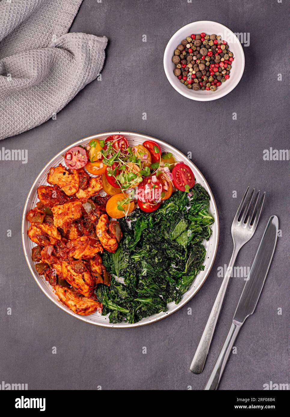 Food photography of fried kale, leaf, cabbage, chicken; stew; casserole; savoury food; curry