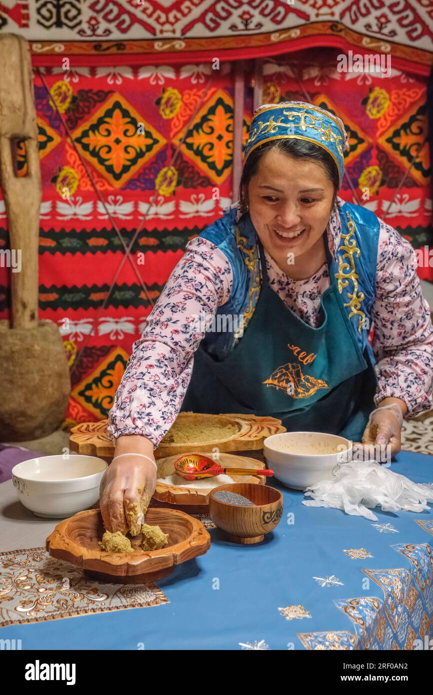 Kazakhstan, Saty. Kazakh Cook Demonstrating how to Make Zhent, a