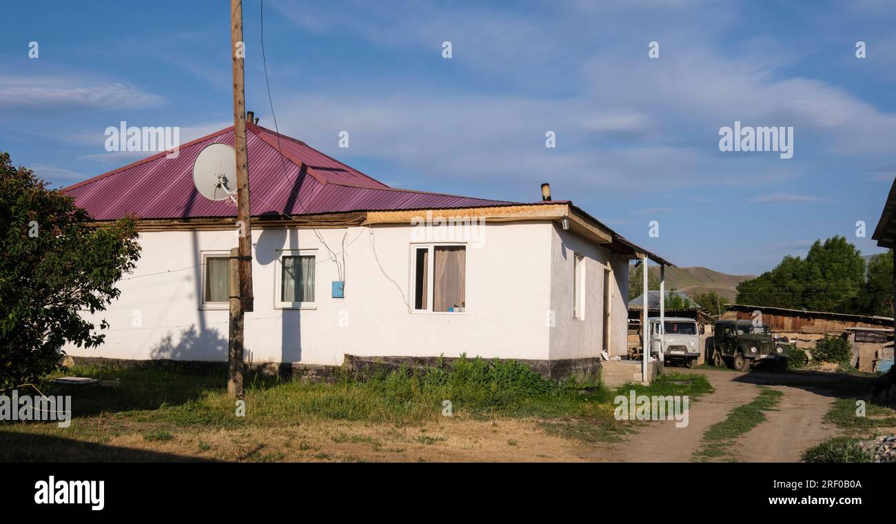Kazakhstan, Saty Village House and Satellite Dish. Stock Photo