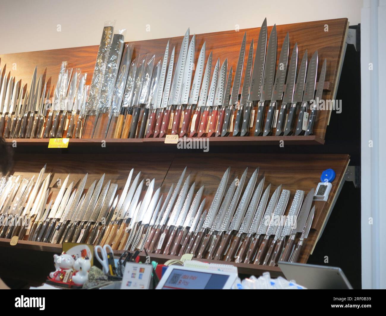 Specialist Japanese cookery knives on display in a cookware shop on Kappabashi Dori in Asakusa, also known as Tokyo's kitchen street. Stock Photo