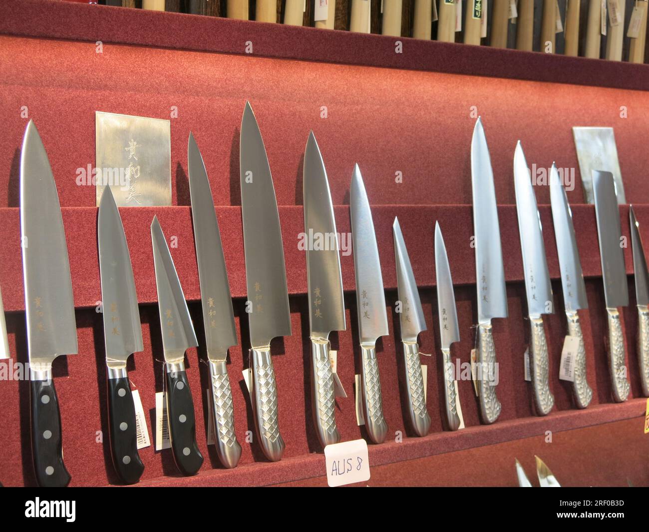 Specialist Japanese cookery knives on display in a cookware shop on Kappabashi Dori in Asakusa, also known as Tokyo's kitchen street. Stock Photo
